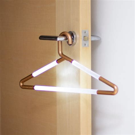 The hang up light is a clothes hanger and a light at the same time. Hang Up Light | Hanger, Cool lamps, Led night light