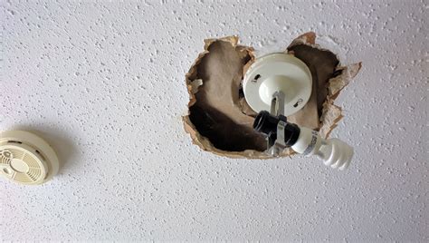 Wipe the sanding dust with a clean cloth. Repairing A Hole Around Light Fixture On Stucco/popcorn ...