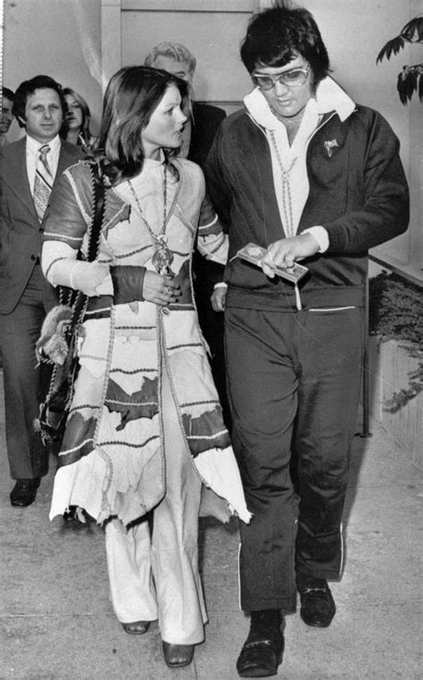 Elvis And Priscilla Presley Walking Out Of Court After Their Divorce 09