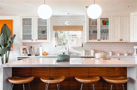 The glass door allows you to see all of our stemware and the one hidden behind the white door houses more glasses but the ones with color that i wouldn't want always showing. What Do You Put In Glass Kitchen Cabinets? - Craftsonfire