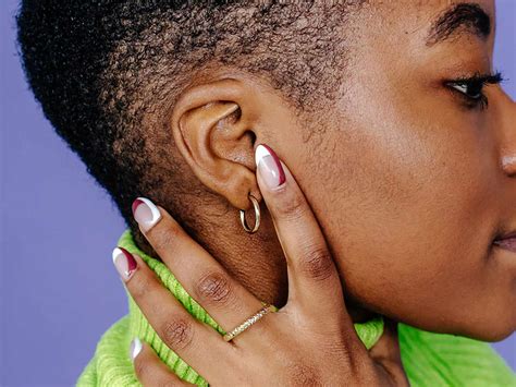 How To Treat An Infected Ear Piercing According To Dermatologists