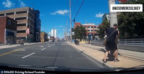 Hilarious Moment That A Jaywalker Walks Into A Street Pole After Trying