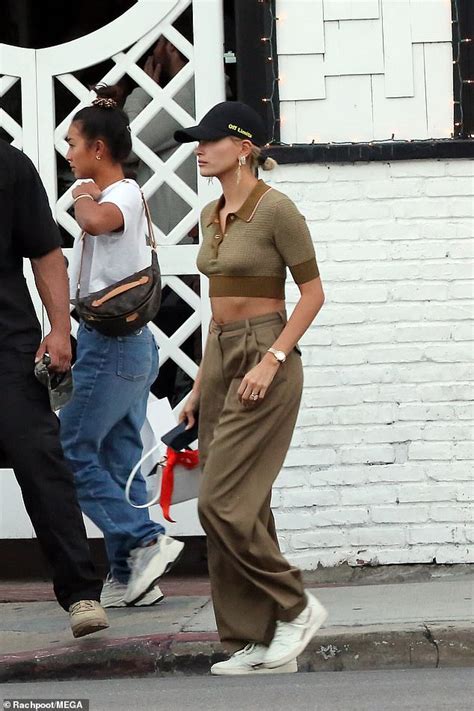 Hailey Bieber Flashes Her Toned Abs In Khaki Crop Top As She Steps Out