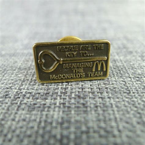 Mcdonalds Lapel Pin People Are The Key To Managing The Team Gold Tone