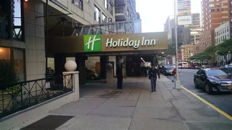 The city has lifted all covid restrictions and is ready to welcome back our guests. Entrance to Holiday Inn Midtown W 57th St in New York City ...