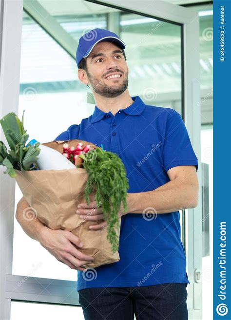 Food Delivery Service Male Worker Holding Grocery Bag Stock Image