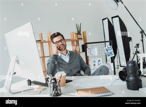 Photographer Working In Office Stock Photo Alamy