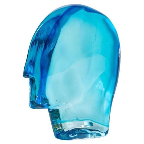 A Blue Glass Head Is Shown Against A White Background