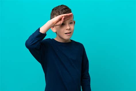 Premium Photo Little Kid Boy Isolated On Blue Background Looking Far