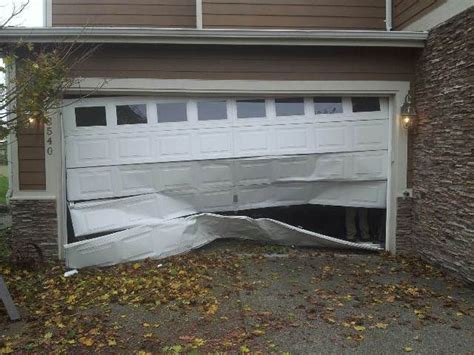 What To Do When Your Garage Door Is Damaged Or Broken Door Spring