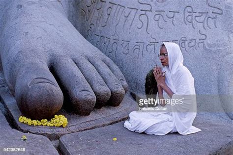 Jain Nun At The Foot Of Lord Bahubalis Statue In Sravanabelagola A