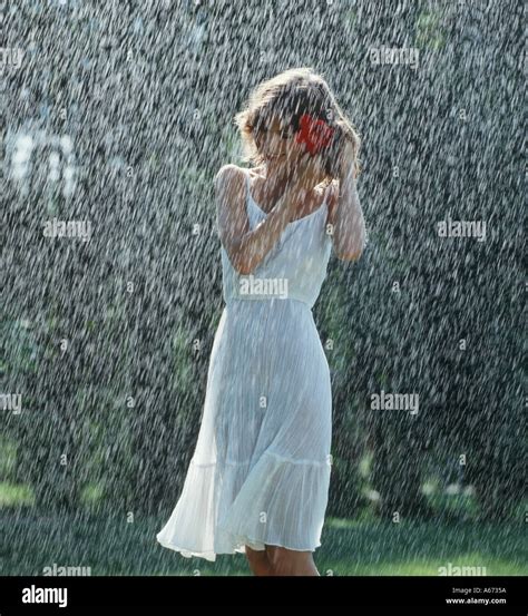 Girl Walking Alone In Rain In Park Stock Photo Alamy