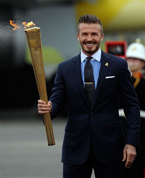 David Beckham With The Olympic Torch
