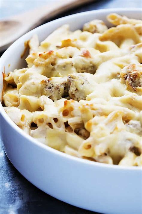 A cheesy hot italian pasta bake with a spiced savory and sweet marinara sauce, hot italian flavors and plenty of cheese. Baked Cheesy Sausage Penne - Creme De La Crumb