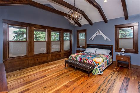 Check out this article to see some examples of this design trick. master bedroom, exposed wood beams, rustic wood flooring ...