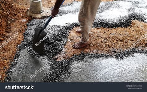 Manual Leveling Concrete By Using Shovel Stock Photo 1078600538
