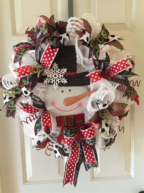 I already had a bunch of hats and scarves at home to choose from. Christmas wreath, snowman wreath, deco mesh wreath ...