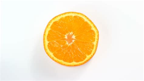 Orange Slice Rotating On White Stock Footage Video 100
