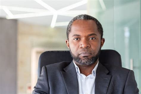 Successful Mature African American Businessman At Work Inside Office