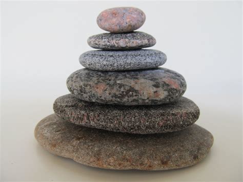 A Stack Of Rocks Sitting On Top Of Each Other