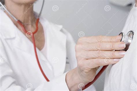 Doctor Checking Patients Heartbeat Using Stethoscope Stock Photo