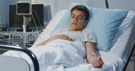 Teenager Boy Lying In Hospital Stock Photo Download