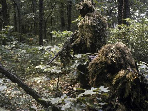 A Marine Sniper Team Wearing Camouflage Ghillie Suits Photographic