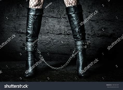 Bdsm Woman S Legs In High Black Leather Boots Chained Stock Photo Shutterstock