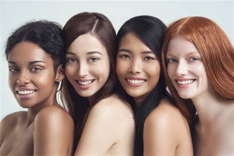 Multi Ethnic Nude Women Posing Together Stock Photo