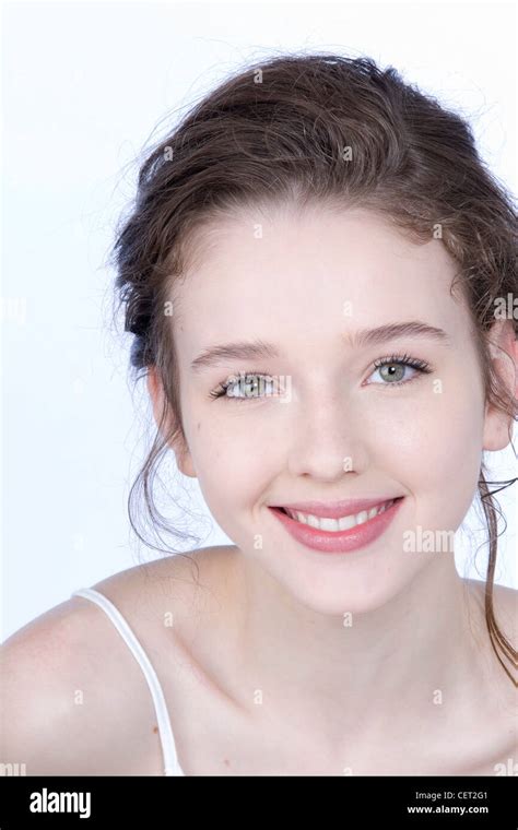 Female With Brunette Hair Off Her Face With Clean Pale Skin And