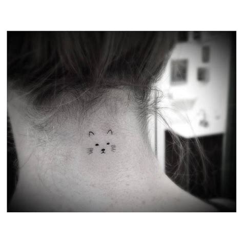 Minimalist Cat Face Tattoo On The Back Of The Neck
