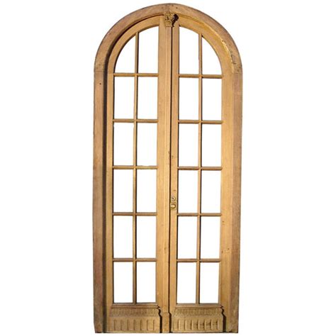Custom mahogany double entry doors , custom mahogany panel bottom arched exterior double doors , exterior custom mahogany doors with glass , arched double doors , arched double doors interior , mahogany double entrance doors charleston sc , myrtle beach , hilton head , savannah ga , wilmington nc and custom amish doors. Arched double glass French Door at 1stdibs