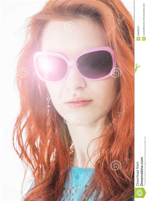 Beautiful Girl With Red Hair And Sunglasses Stock Photo
