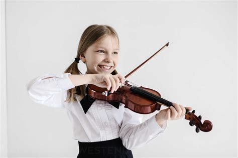 Happy Girl Playing Violin Stock Photo