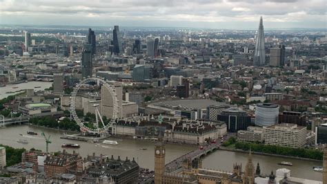 6K stock footage aerial video of skyscrapers in Central London, London Eye and Parliament ...