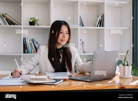 Business Asian Woman Working With Laptop For Financial Document In Office Female Accountant