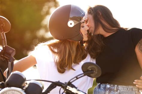 Free Photo Two Lesbian Women Kissing While On A Motorcycle With