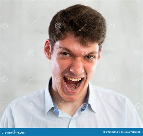 Portrait of Young Screaming Guy in Studio Stock Photo - Image of wall