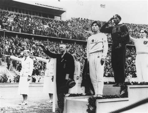 Jesse Owens On The Podium At The 1936 Berlin Olympics After Winning