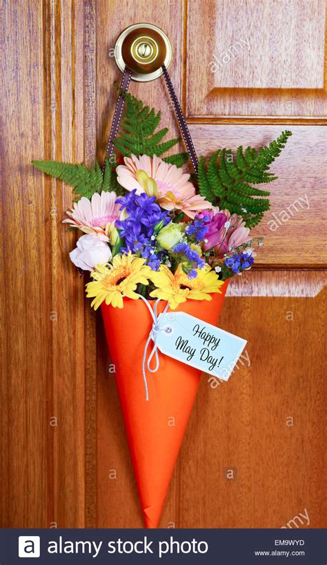 May day celebrations have been carried out in england for over 2000 years. Happy May Day traditional gift of Spring flowers in orange cone Stock Photo: 81352529 - Alamy