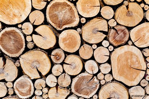 Wall Of Stacked Wood Logs As Background Pile Of Wood Stock Photo