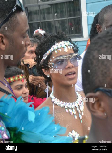 rihanna nearly bares it all in an extremely skimpy jeweled bikini as she attends the kadooment