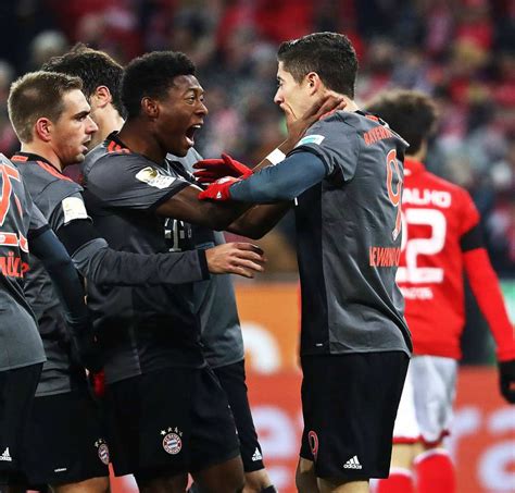 This video is not reference to the relevant match. Bundesliga: Lewandowski Double At Mainz Puts Bayern Munich Back On Top