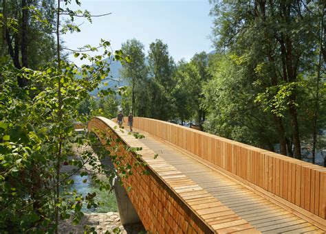 Architects Create Beautiful Arched Footbridge Out Of Timber Planks And