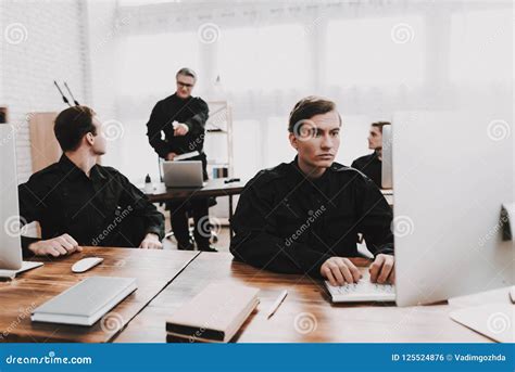 Officer Instructs Subordinates In Police Station Stock Photo Image