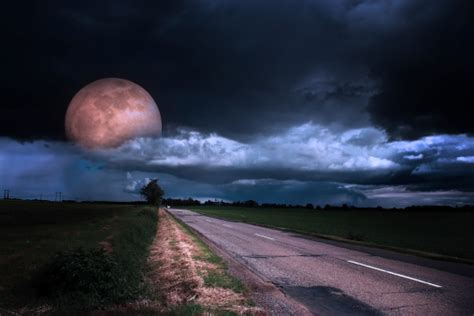 Asphalt Road At Night With Moon Stock Photo Download Image Now