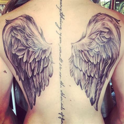 Beautiful Realistic Feathers Angel Wings Tattoo On Girl Back With