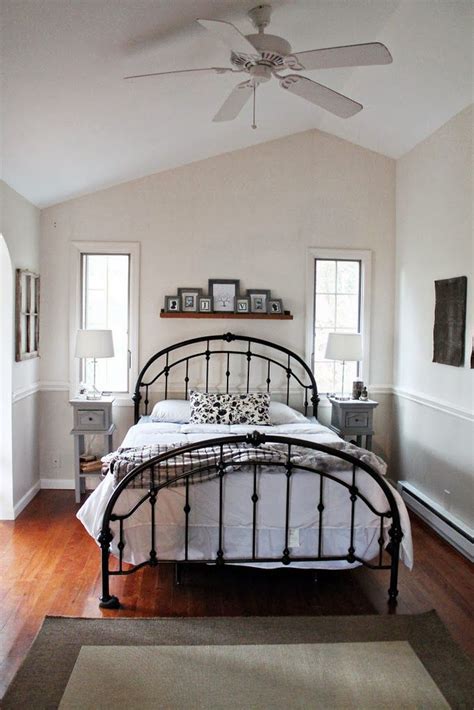 Large stone archway for elegant kitchen design. Black, gray and tan bedroom | Tan bedroom, Iron bed ...