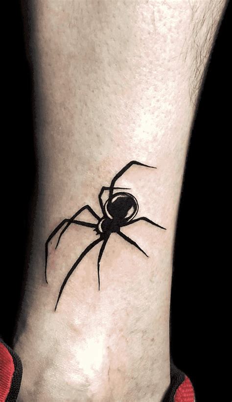 A Small Black Spider Tattoo On The Ankle