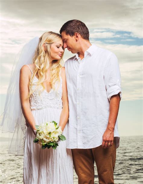Bride And Groom Romantic Newly Married Couple On The Beach Just